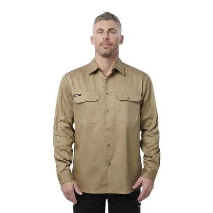 Man wearing a beige long-sleeve shirt on a white background