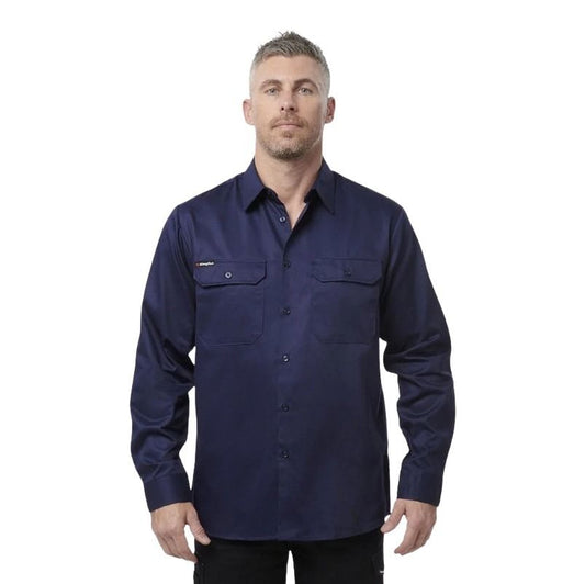 Man wearing a navy long-sleeve shirt on a white background