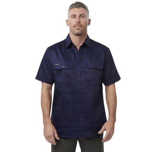 Man wearing a navy short-sleeve shirt on a white background