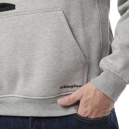 Gray hoodie with a visible brand logo on the chest pocket, worn by a person.
