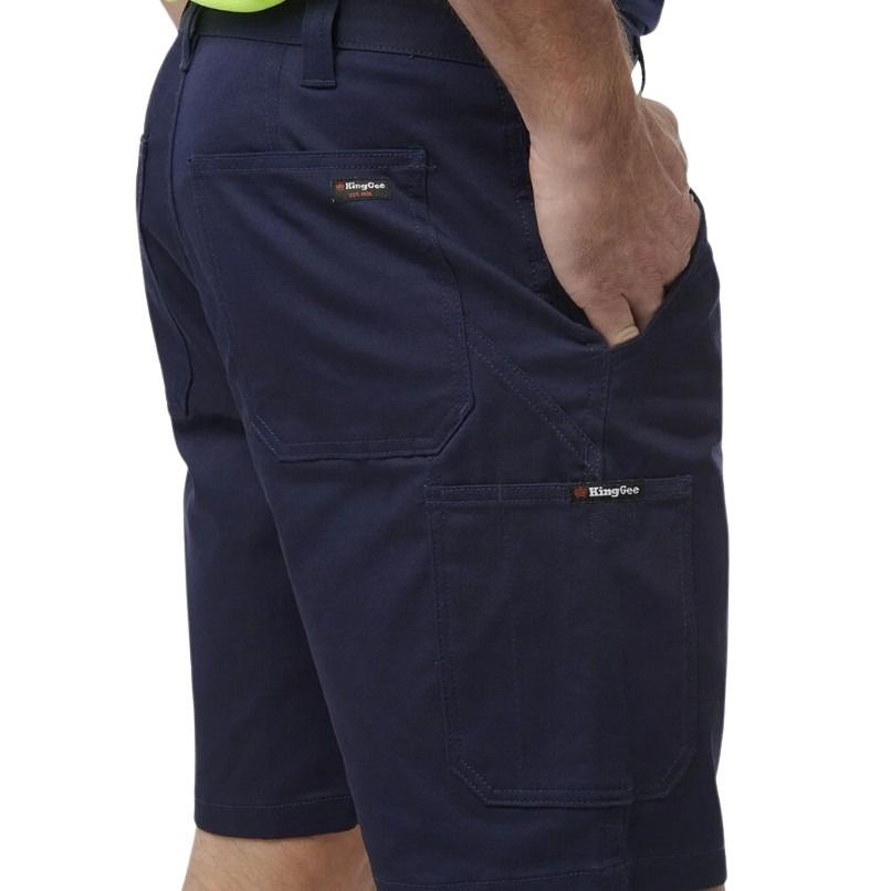 Navy blue shorts with multiple pockets on a white background