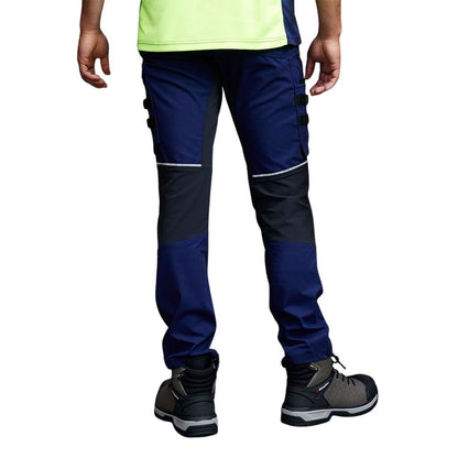 Navy and gray work pants worn by a person on a white background