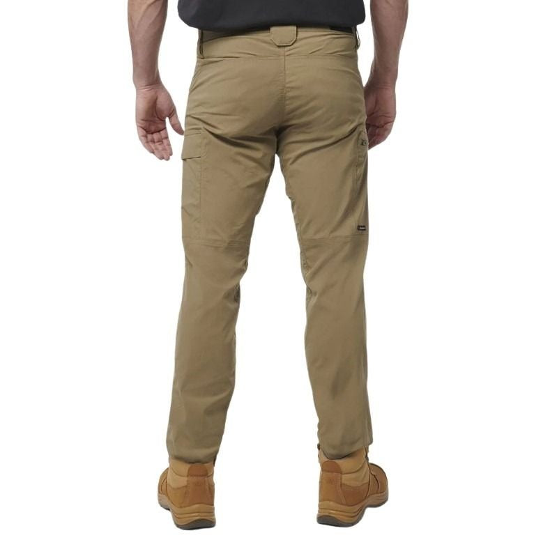Beige pants worn by a person on a white background