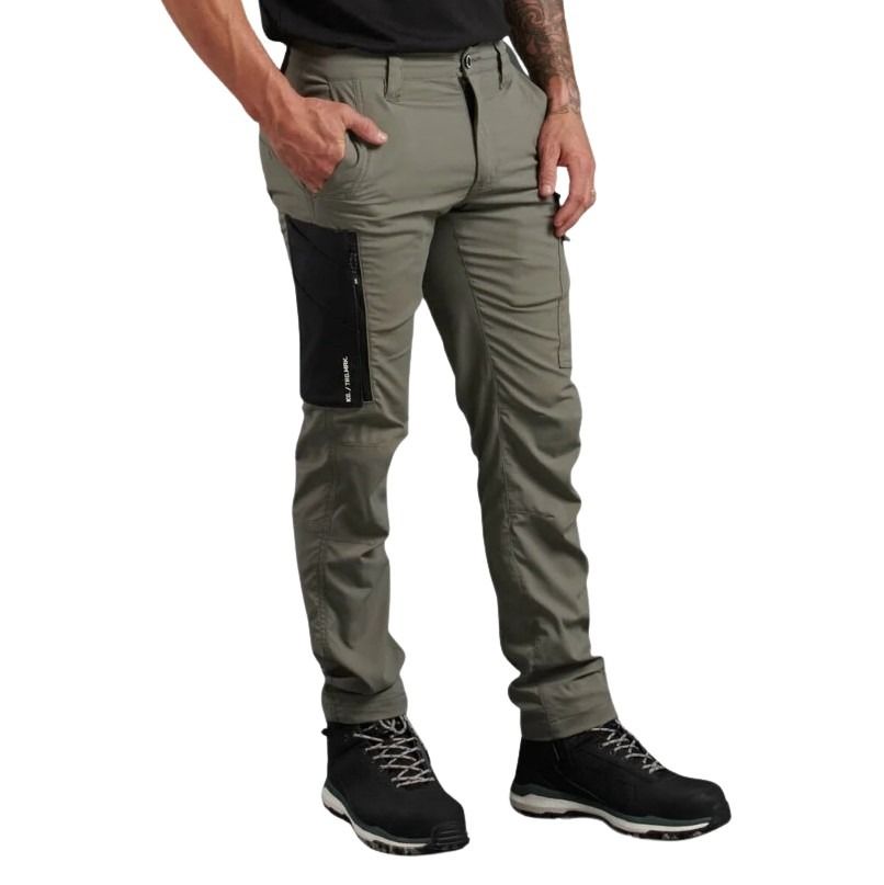 Person wearing gray pants with black accents on a white background