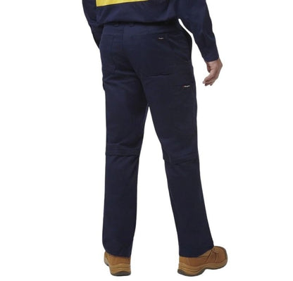 Navy blue work pants worn by a person on a white background