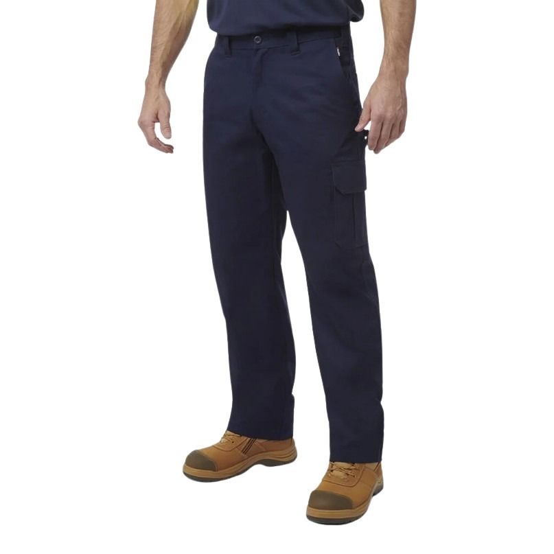 Person wearing navy cargo pants and brown work boots on a white background