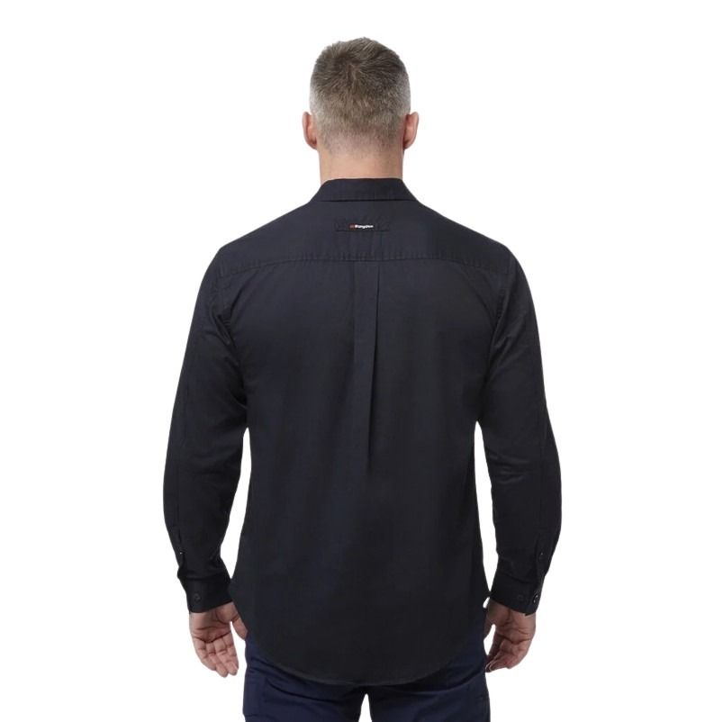 Man wearing a black shirt with a visible brand logo on the back, standing against a white background