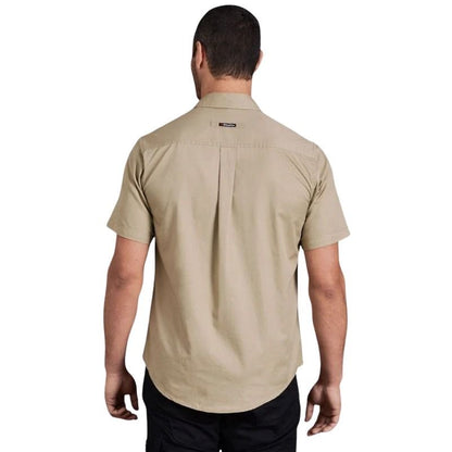 Man wearing a beige short-sleeve shirt on a white background