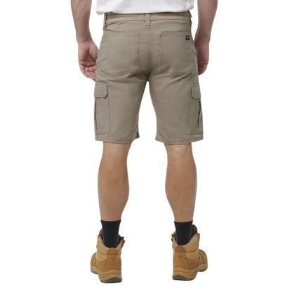 Person wearing beige cargo shorts on a white background