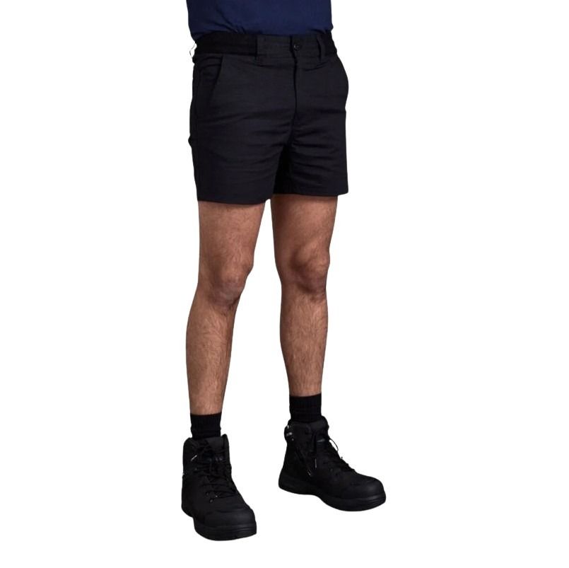 Person wearing black shorts and black boots on a white background