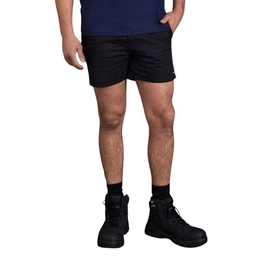 Person wearing black shorts and black shoes on a white background