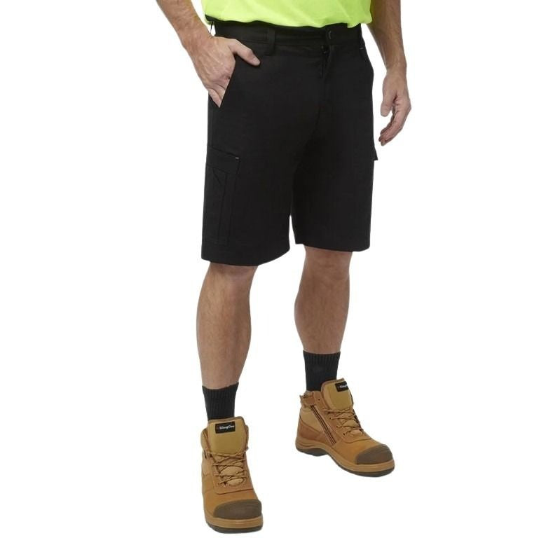 Person wearing black shorts, a yellow shirt, and brown boots on a white background