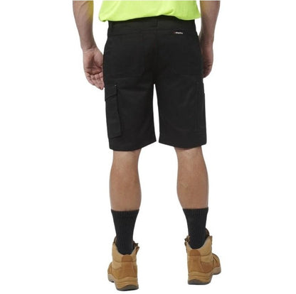 Person wearing black cargo shorts on a white background