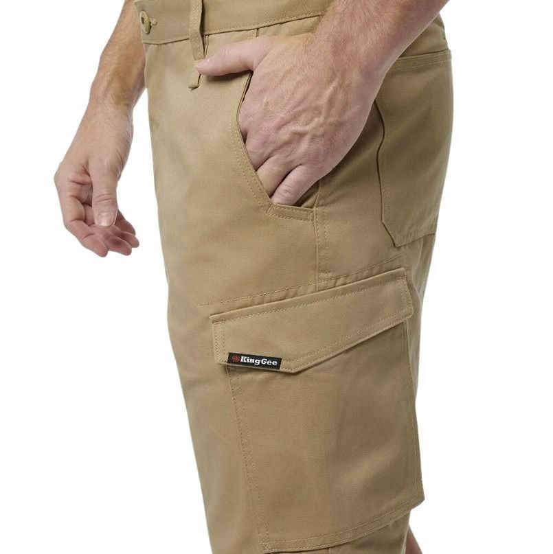 Beige cargo shorts with a brand label on a white background