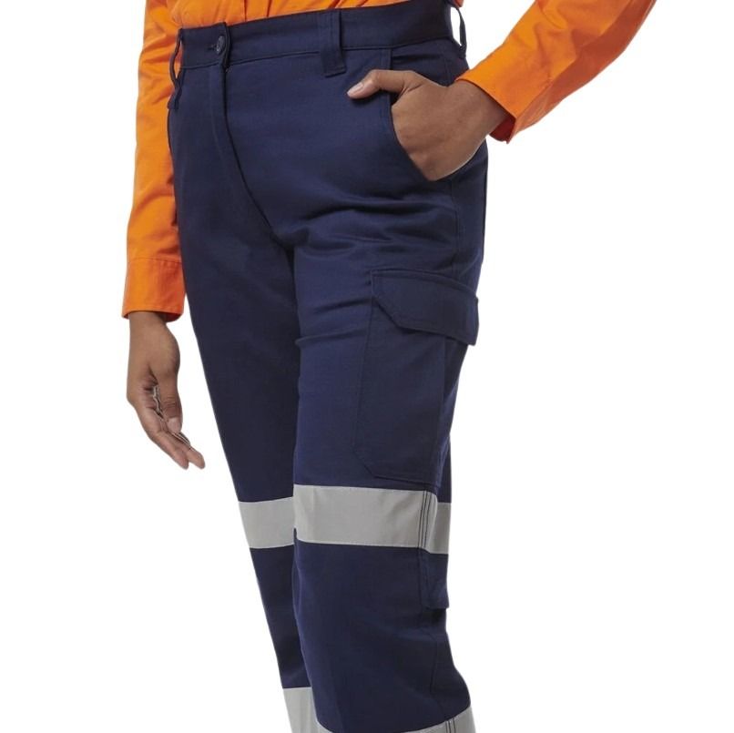 Navy work pants with reflective stripes worn by a person in an orange shirt on a white background