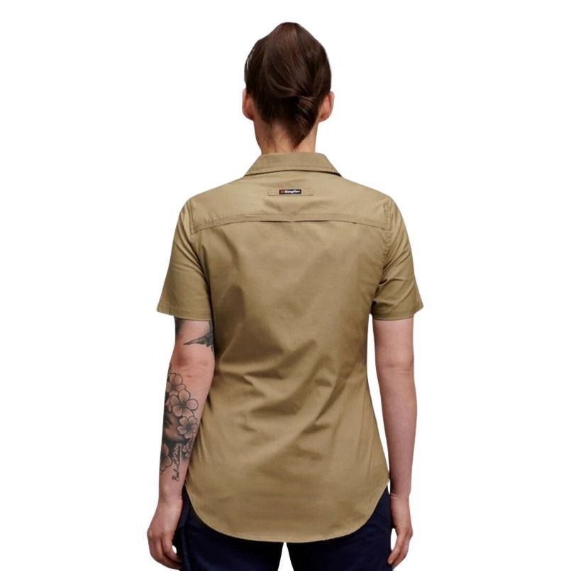 Person wearing a beige short-sleeve shirt on a white background
