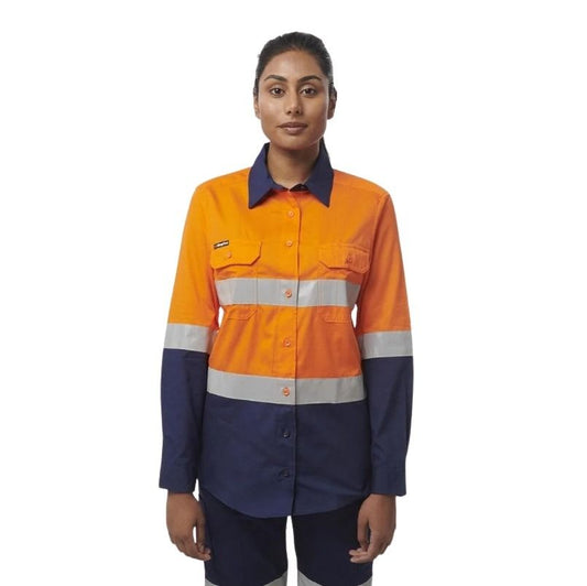 Person wearing an orange and navy work shirt with reflective stripes on a white background