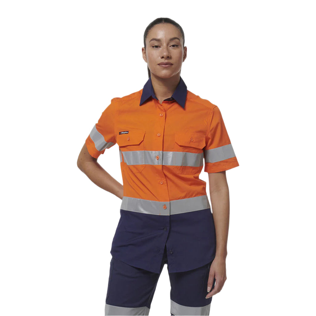 Person wearing an orange and navy work uniform with reflective stripes on a white background