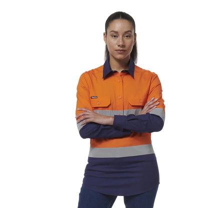 Person wearing an orange and navy work shirt with reflective stripes on a white background