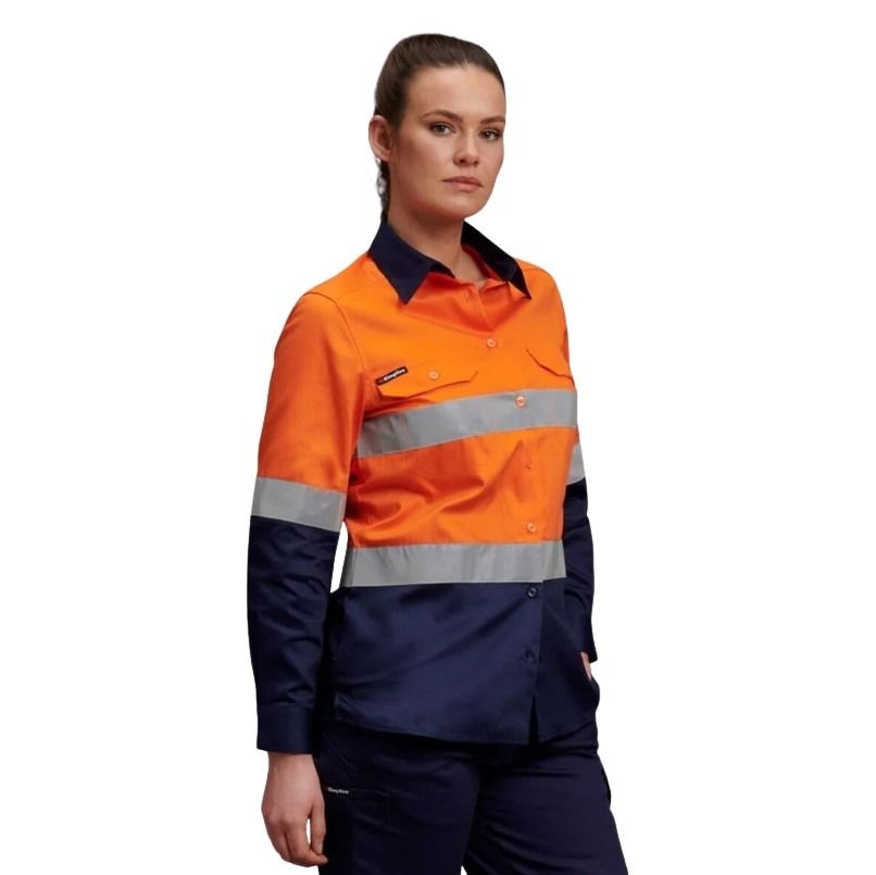 Person wearing an orange and navy high-visibility work shirt on a white background