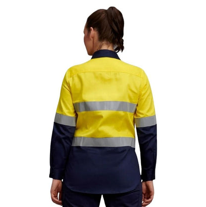 Person wearing a yellow and navy reflective safety jacket on a white background