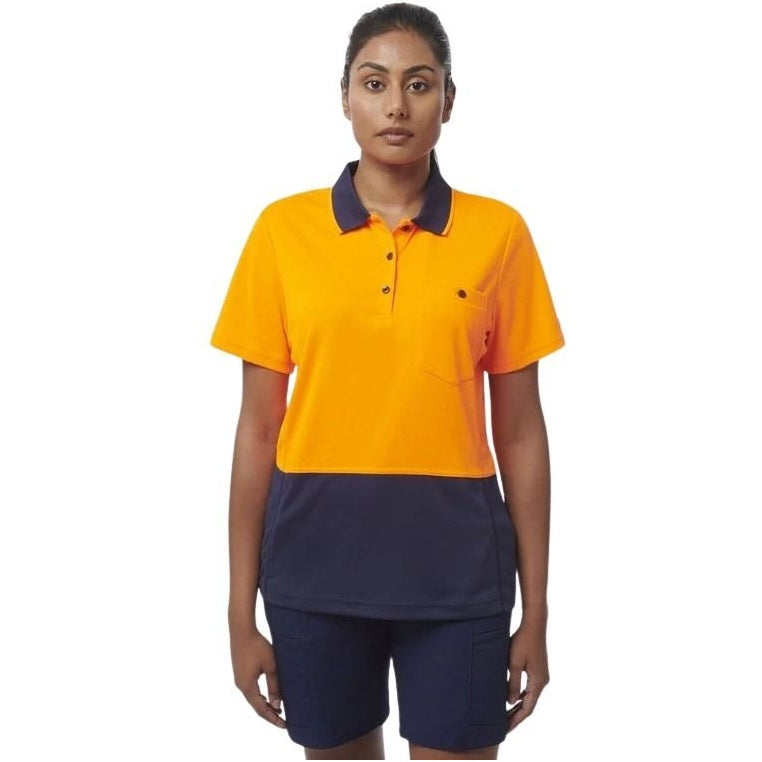 Person wearing an orange and navy polo shirt with navy shorts on a white background