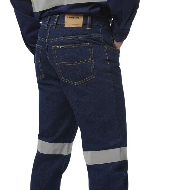 Dark blue work pants with reflective stripes on a white background