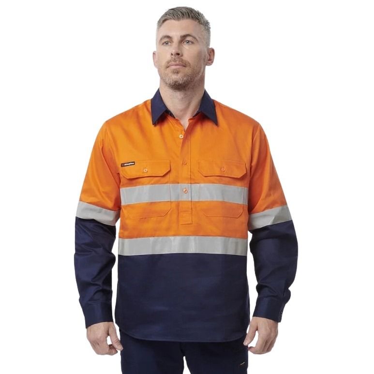 Man in orange spliced shirt with reflective tape brand name king gee on white background with two front pockets and half button placard