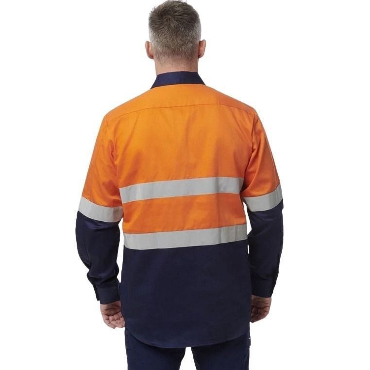 Man in orange spliced shirt with reflective tape brand name king gee on white background with two front pockets and half button placard