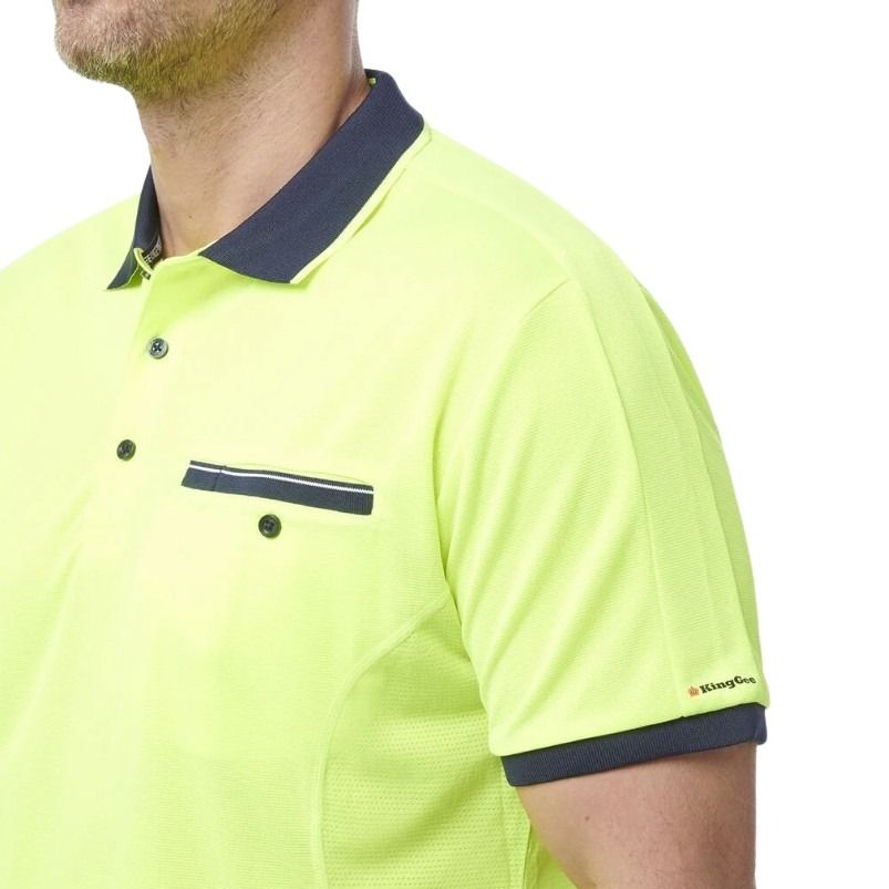 yellow and navy spliced polo on white background