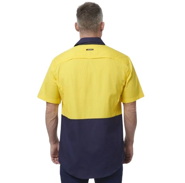 Spliced yellow and navy shirt on white background