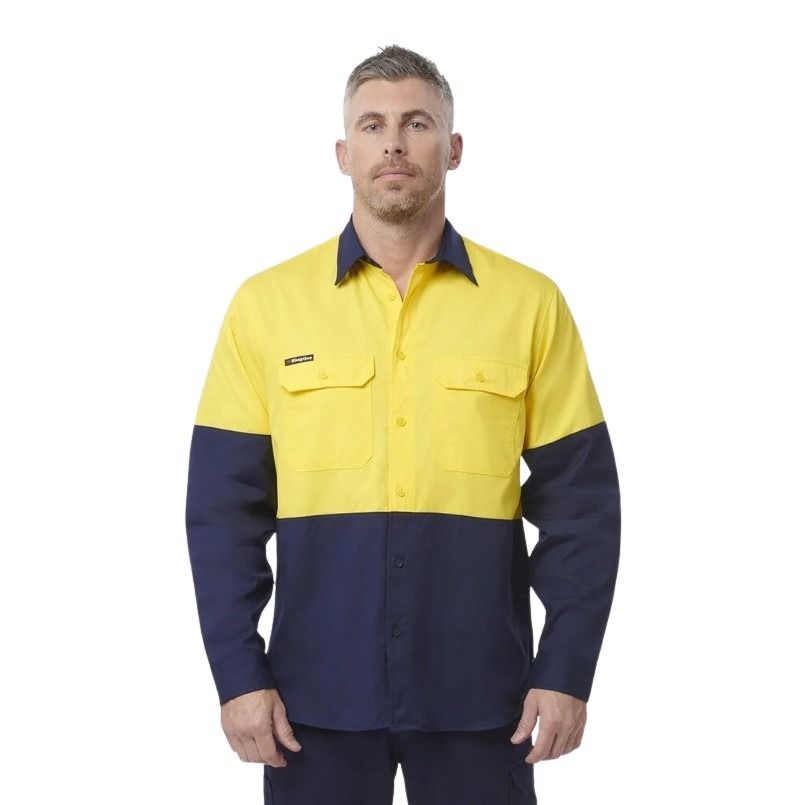 Man wearing a yellow and navy work shirt on a white background