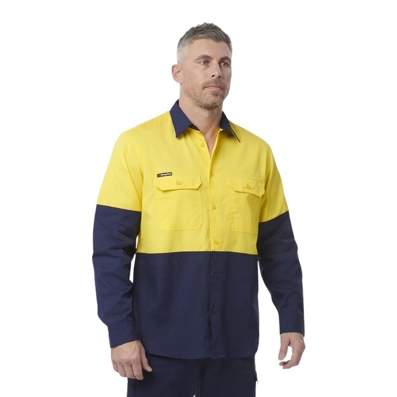 Man wearing a yellow and navy work shirt on a white background