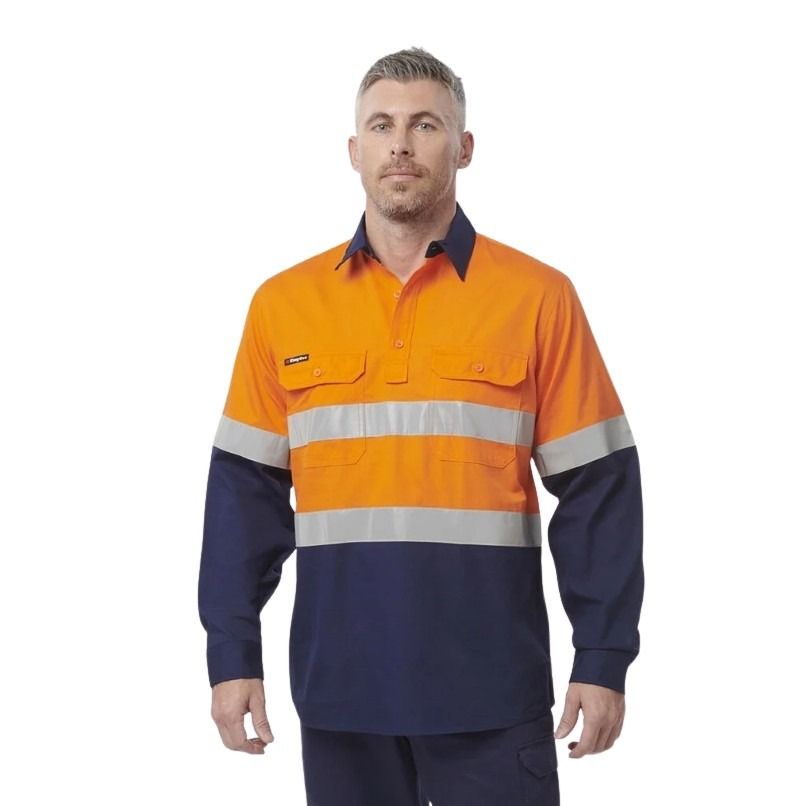 Man wearing an orange and navy high-visibility work shirt on a white background
