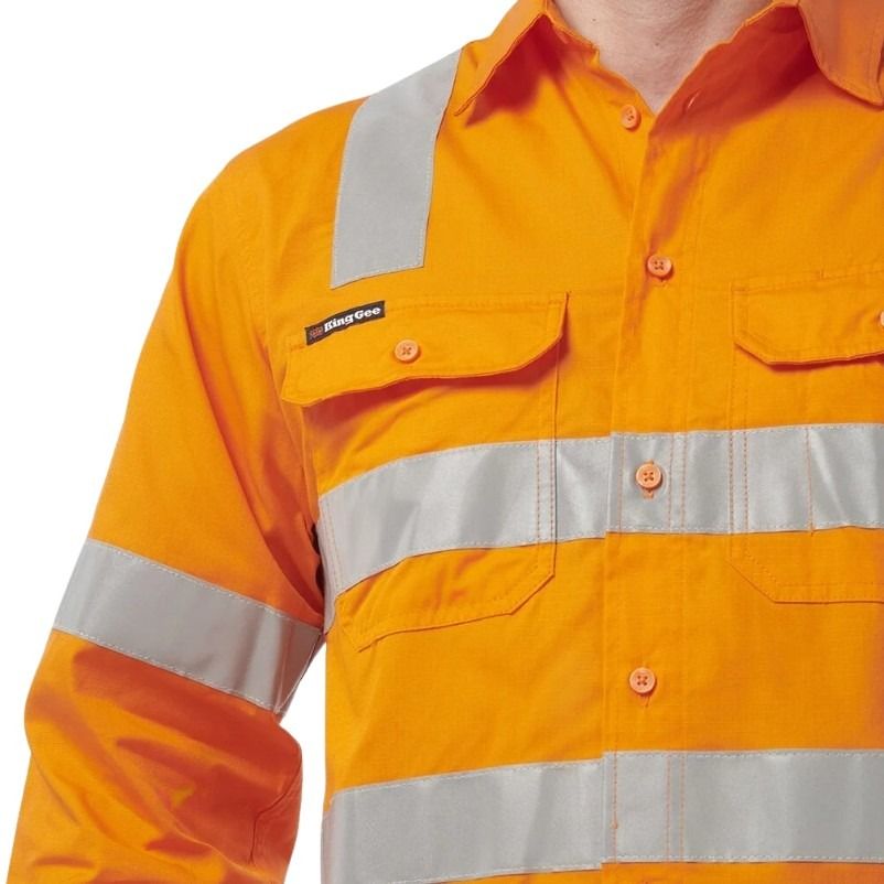 Orange safety shirt with reflective stripes on a white background