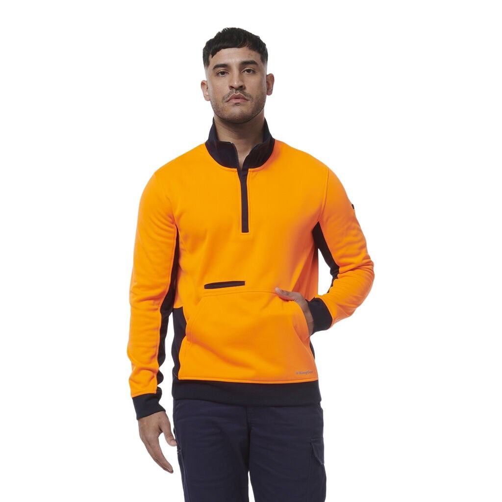 Man wearing an orange and black PULLOVER on a white background