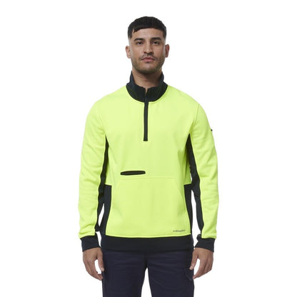 Man wearing a bright yellow and black PULLOVER on a white background