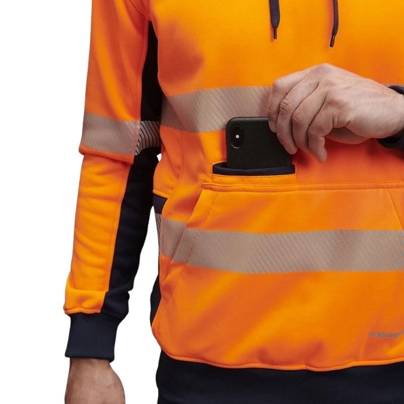 Person wearing an orange high-visibility jacket holding a phone.
