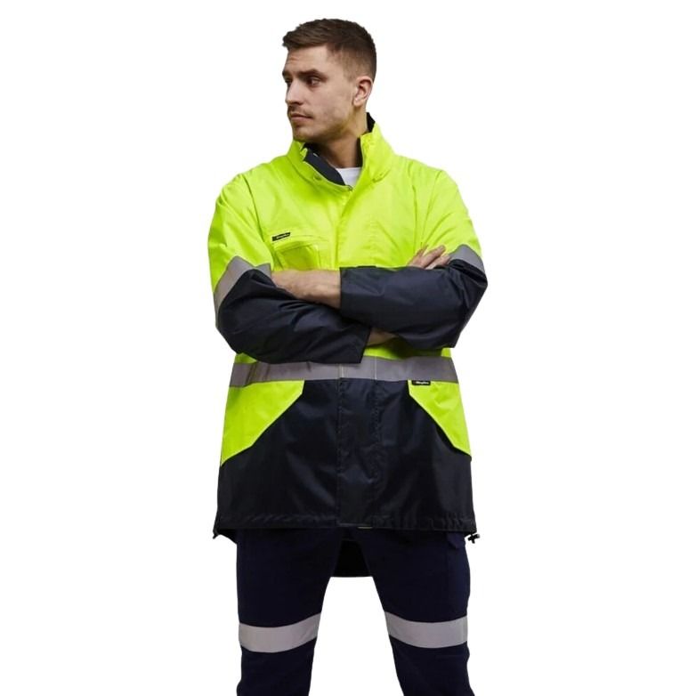 Person wearing a high-visibility jacket with reflective stripes on a white background
