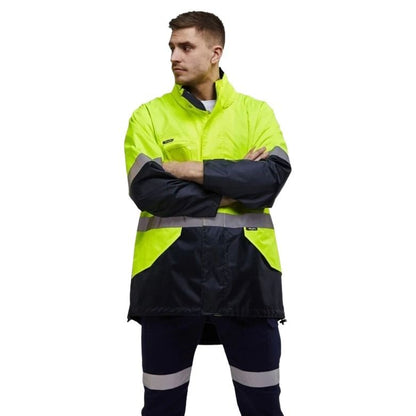 Person wearing a high-visibility jacket with reflective stripes on a white background