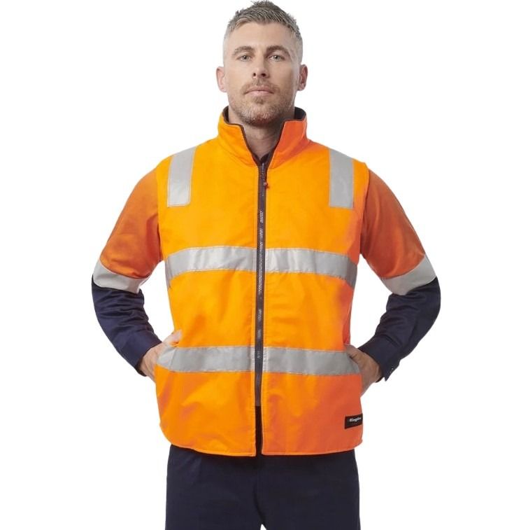 Man wearing an orange high-visibility safety jacket on a white background