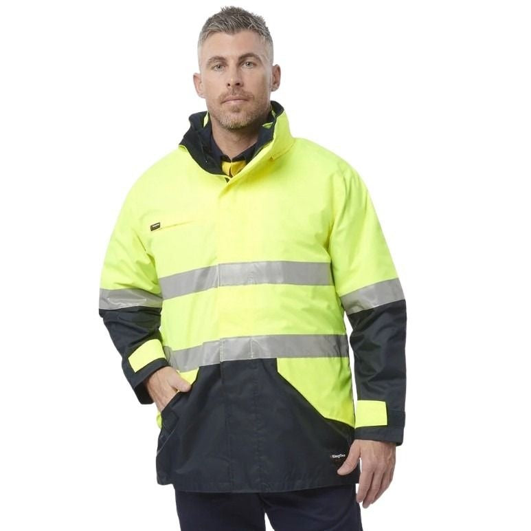 Man wearing a high-visibility jacket with reflective stripes on a white background