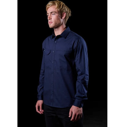 Man wearing a navy blue shirt against a black background