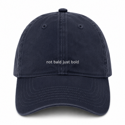 AH130 grace collection dark navy blue cotton baseball cap with the text 'not bald just bold' embroidered in white across the front