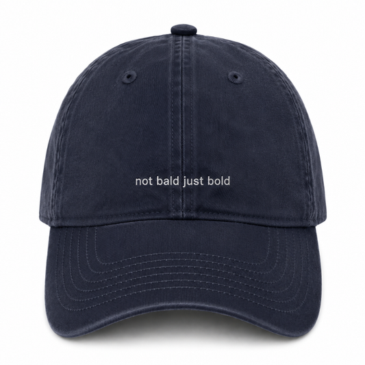 AH130 grace collection dark navy blue cotton baseball cap with the text 'not bald just bold' embroidered in white across the front