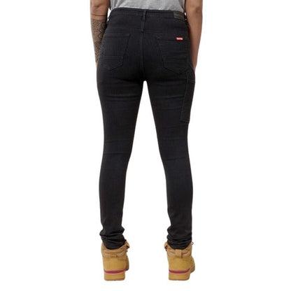 Person wearing black jeans on a white background