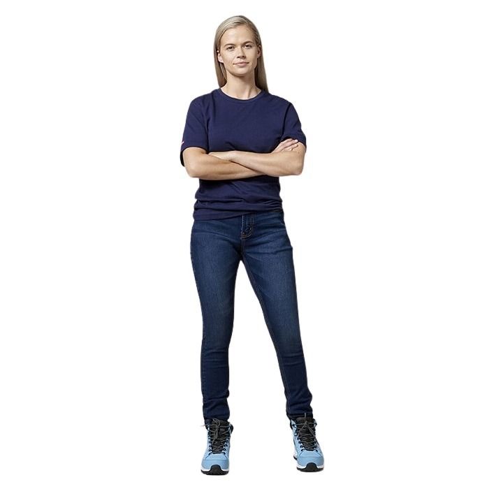 Person wearing a navy t-shirt and blue jeans standing against a white background