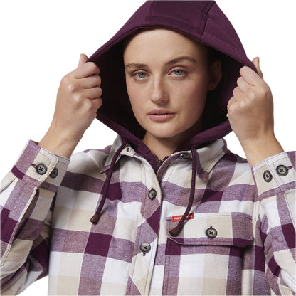 Woman wearing a purple and white checkered jacket with a hood 