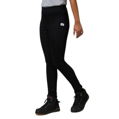 Person wearing black leggings with a small logo on a white background